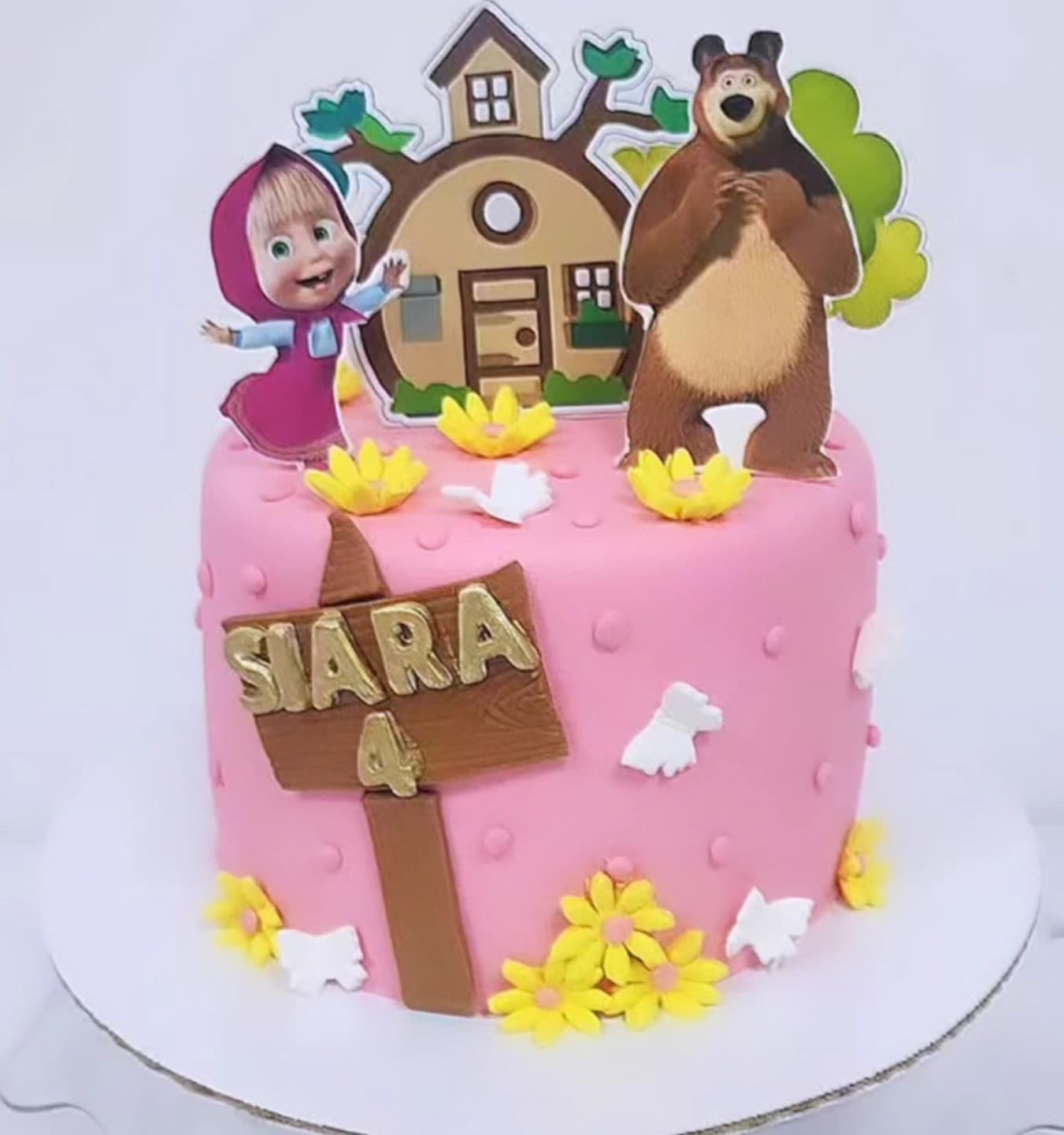 Torta Masha dhe Ariu Rozë - Torte për Fëmijë | Tortelinda Tortë rozë me figura të Masha dhe Ariu dhe lule të verdha
